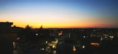 a view of a city at sunset at Penthouse loft with view in Rome