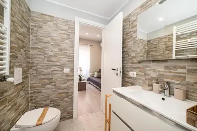 a bathroom with a toilet and a sink at Le Quattro Stagioni Vatican City in Rome