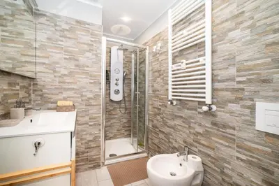 a bathroom with a shower and a sink and a toilet at Le Quattro Stagioni Vatican City in Rome