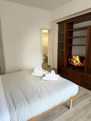 a bedroom with a bed with two towels on it at Cerreto Suite Housing in Rome