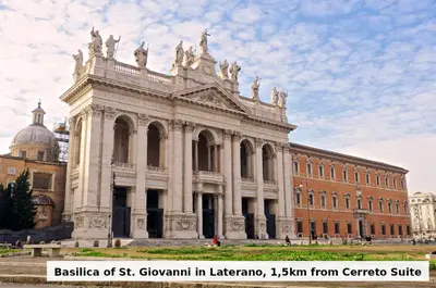 a large building in front of a brick building at Cerreto Suite Housing in Rome