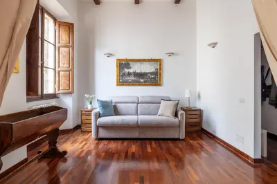 a living room with a couch and a piano at Luxury apartment in the Heart of Rome - near metro A and B in Rome