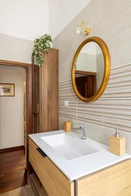 a bathroom with a white sink and a mirror at Luxury apartment in the Heart of Rome - near metro A and B in Rome
