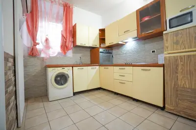 a kitchen with a washer and a washing machine at Dimora San Giovanni in Rome