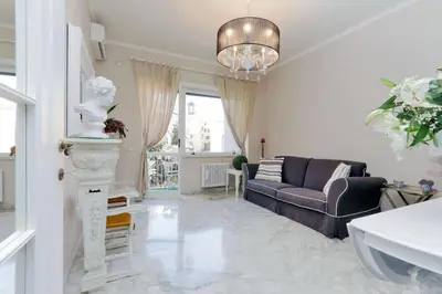 a living room with a couch and a chair at Vatican Art House in Rome