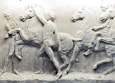 a sculpture of men on horses on a wall at Vatican Art House in Rome