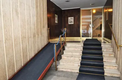 a set of stairs in a building with a staircase at Vatican Art House in Rome
