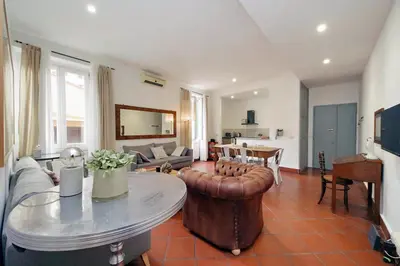 a living room with a couch and a table at Pantheon 2 Bedrooms in Rome