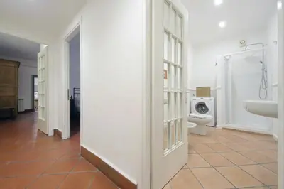 a bathroom with a sink and a washing machine at Pantheon 2 Bedrooms in Rome