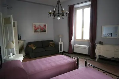 a living room with a couch and a window at Irene's Home The Residence in Rome