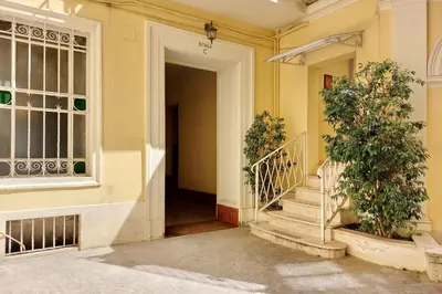 a hallway of a house with stairs and a window at suity I cozy belli apartment in Rome
