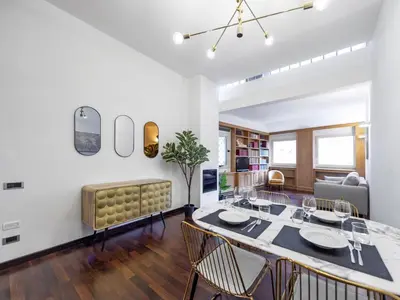 a dining room with a table and chairs at Elizabeth's Place Spanish Steps in Rome