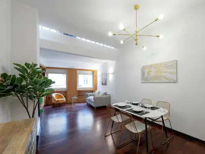 a living room with a table and a couch at Elizabeth's Place Spanish Steps in Rome