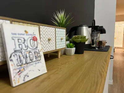 a kitchen counter with a roo himself sign on it at Roma Furio Camillo Holiday Home in Rome