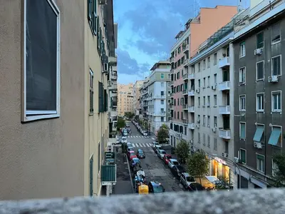 a view of a city street with cars and buildings at Roma Furio Camillo Holiday Home in Rome