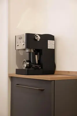 a coffee machine sitting on top of a counter at Casa vacanze Holly in Rome