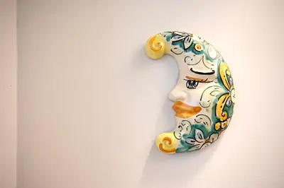 a ceramic number is hanging on a wall at Mirabilia Suites Colosseum in Rome