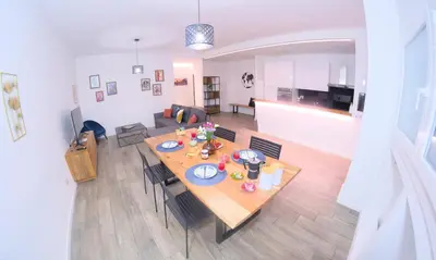 an aerial view of a living room with a table and chairs at Toscani 24 in Rome