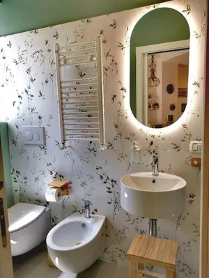 a bathroom with a sink and a mirror at Apuleio 11 in Rome