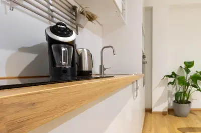 a kitchen counter with a coffee maker on it at Cozy Vatican in Rome