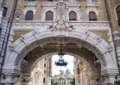 an archway in a building with a statue at Casa Coppedè in Rome