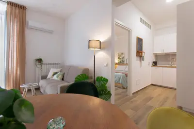 a living room with a couch and a table at Casa Coppedè in Rome