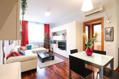 a living room with a couch and a table at Margot - Quiet and Elegant with Free Parking in Rome