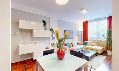 a living room with a couch and a table at Margot - Quiet and Elegant with Free Parking in Rome