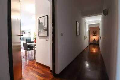 a hallway leading to a living room and a dining room at Margot - Quiet and Elegant with Free Parking in Rome