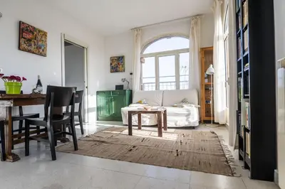 a living room with a table and a couch at St John Basilica Lovely Tower Apartment in Rome
