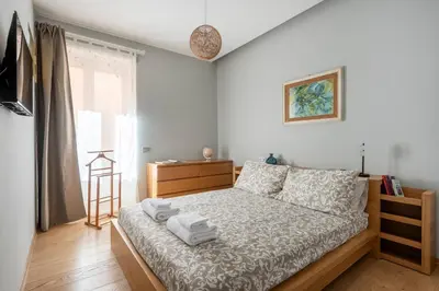 a bedroom with a bed with towels on it at Première in Rome