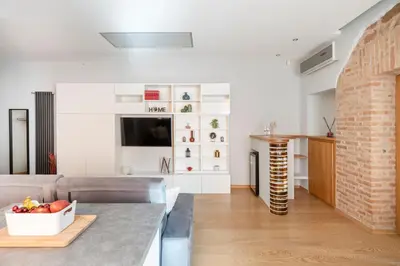 a living room with a couch and a table at Première in Rome