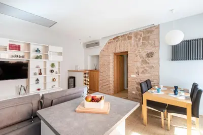 a living room with a couch and a table at Première in Rome