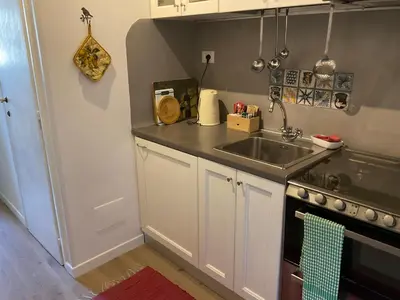 a small kitchen with a sink and a stove at Al campanile Trastevere apartment in Rome