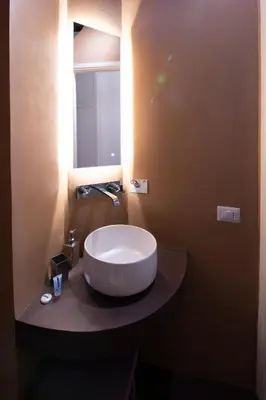 a bathroom with a large white sink on a counter at Al campanile Trastevere apartment in Rome