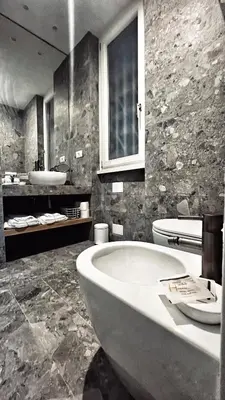 a bathroom with a tub and a sink and a toilet at Archimede 35 One step away from the center in Rome