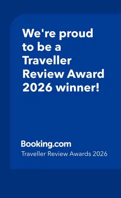 a blue sign that says were proud to be a traveler review award winner at Archimede 35 One step away from the center in Rome