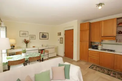 a living room with a white couch and a table at Pironti Flat in Rome