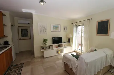 a living room with a couch and a tv at Pironti Flat in Rome