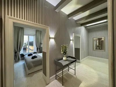 a bedroom with a bed and a table in it at rome via veneto in Rome