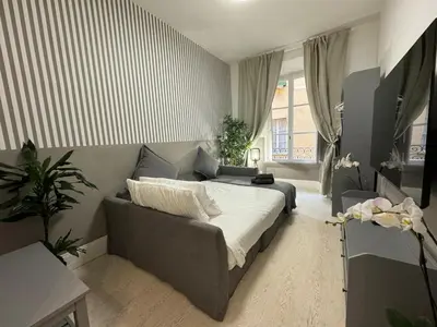 a bedroom with a bed and a couch in a room at rome via veneto in Rome
