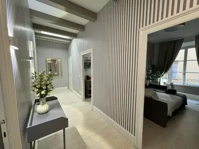 a bedroom with a bed and a large mirror at rome via veneto in Rome