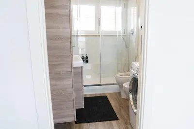 a bathroom with a shower and a toilet at Attico Esclusivo Trastevere with Rooftop Terrace in Rome