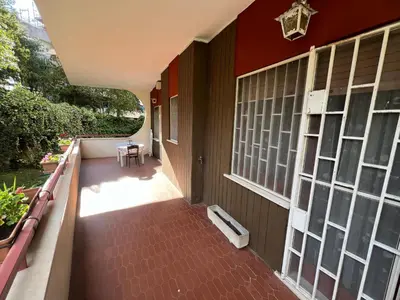 a balcony of a house with a red wall at Paki House Luxury in Rome