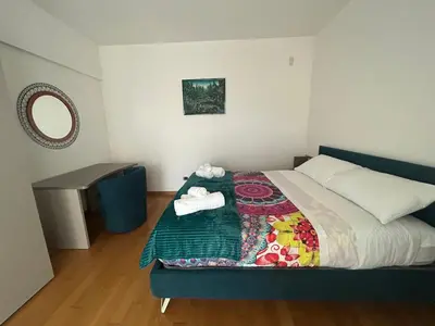 a bedroom with a bed with a quilt on it at Del Vecchio Apartment in Rome