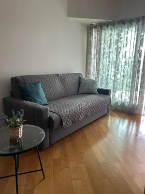 a living room with a couch and a table at Del Vecchio Apartment in Rome