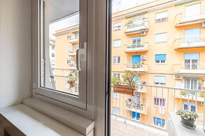 a window with a view of a building at St Peter House by Varental in Rome