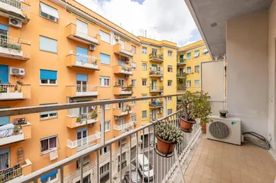 a balcony of a building with potted plants at St Peter House by Varental in Rome