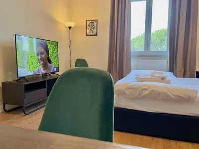 a hotel room with a bed and a television at Onesti House - San Paolo in Rome