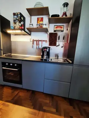 a kitchen with a sink and a stove at Casa Di Lella, a due passi dal Vaticano in Rome